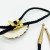 Krawatnik z Psem – detal odlanego elementu z brązu na plastrze z poroża